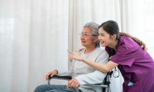 asian-young-nurse-taking-care-and-talking-mature-female-patient-e1717664029182.jpg