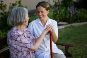 woman-talking-to-doctor-while-sitting-on-bench-at-park.jpg